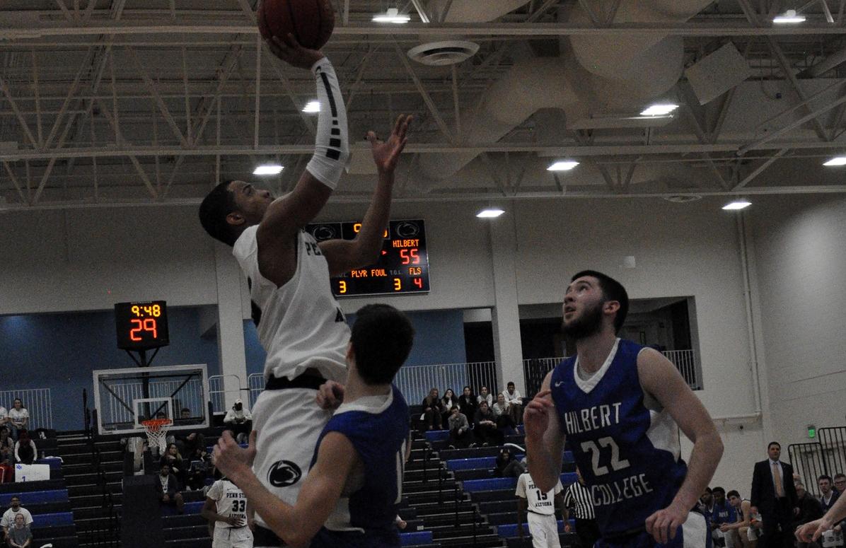 Photo (by Kelsey Bristol): Penn State Altoona senior Rich Bouknight drives to the hoop during Wednesday night's AMCC Tournament game against Hilbert in the Adler Arena.
