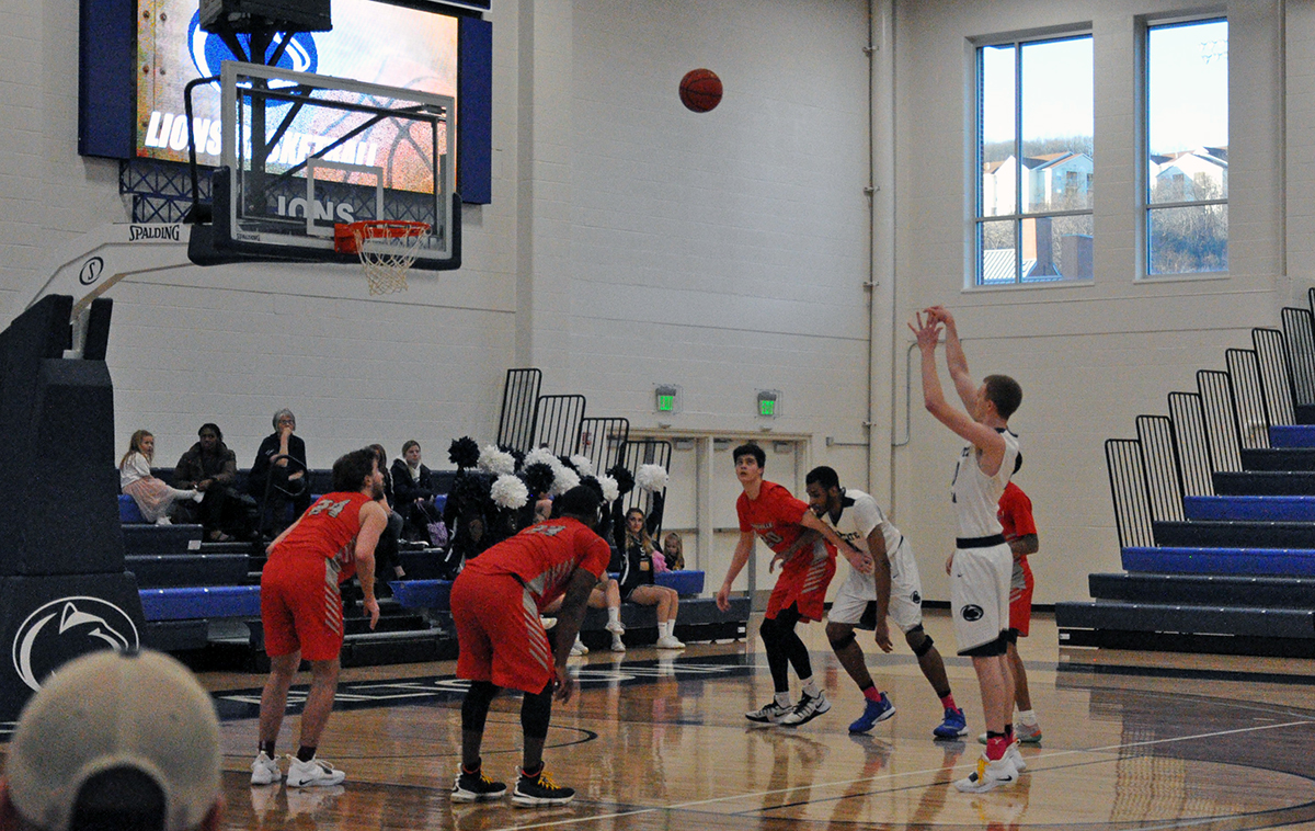 Photo (by Ally Lenz): Senior forward Marshall Higley knocks down a free throw late in the second half against D'Youville on Saturday.