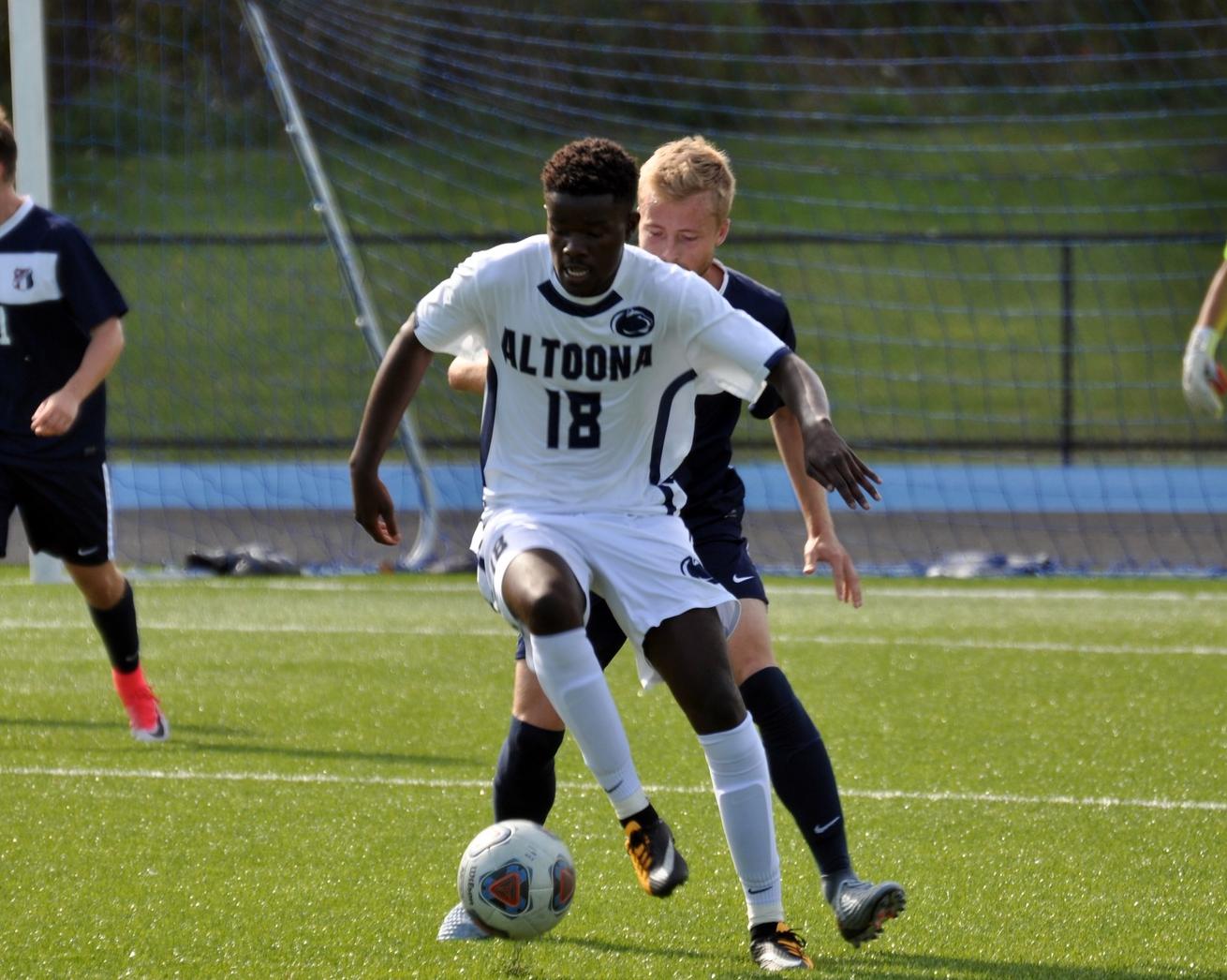 Photo (by Joel Nelson): Penn State Altoona sophomore Emerson Mendes possesses the ball against a Penn State Behrend defender during Saturday afternoon's game at Spring Run Stadium.
