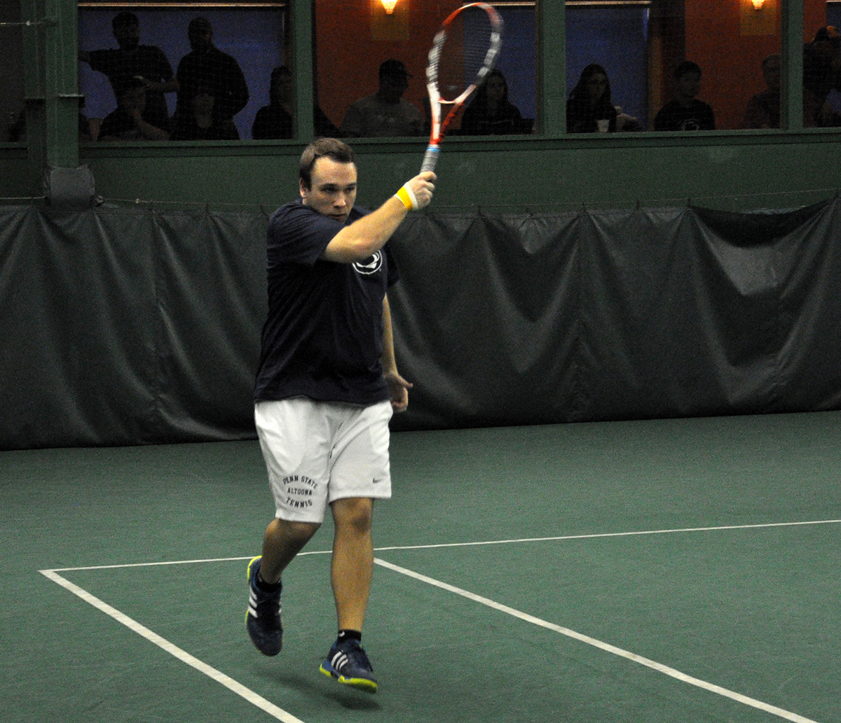 Photo: Penn State Altoona senior Thomas Graden finishes off a forehand shot during Saturday's match against Saint Vincent College at the Gorilla House Gym.