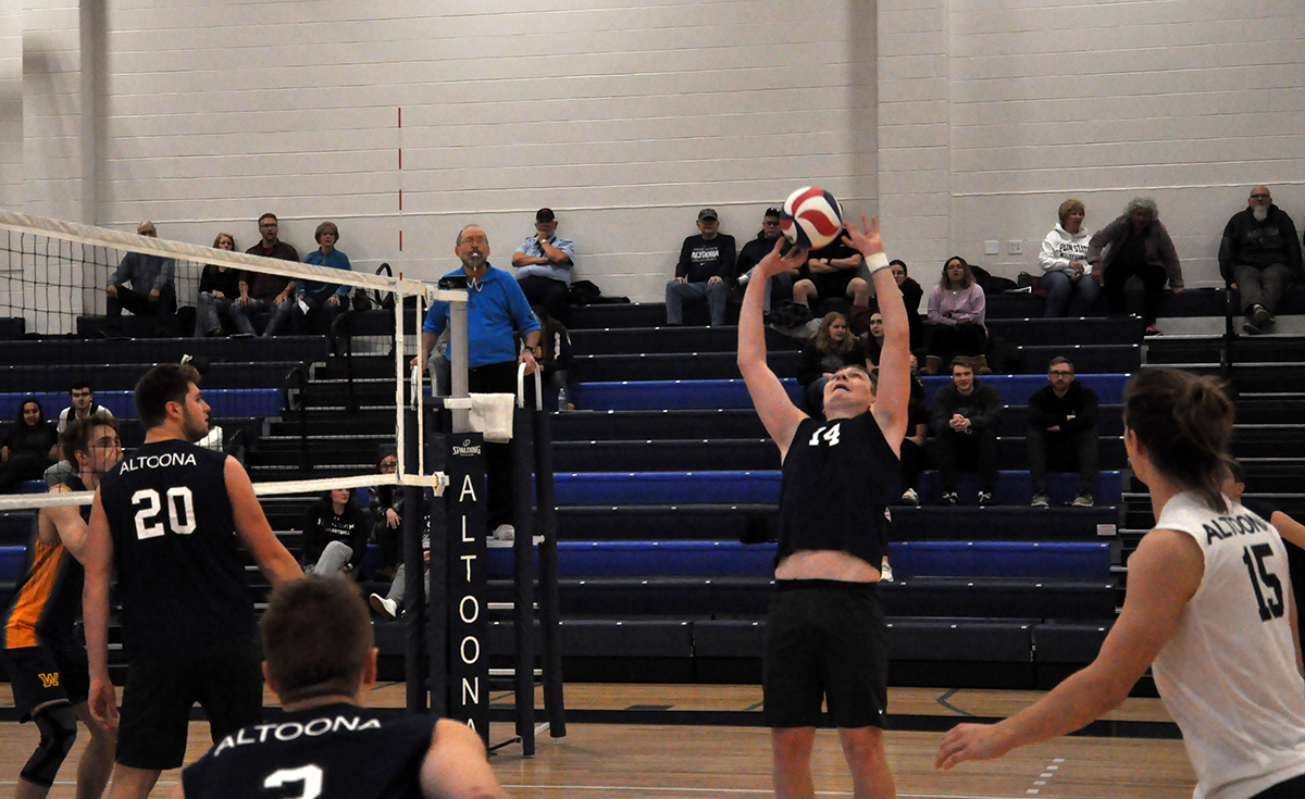 Photo (by Oliver Dailey): Freshman Tyler Sheaffer sets the ball for a teammate during Tuesday's win over Wilkes in the Adler Arena.